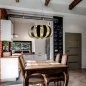 Preview: Flower-like metal dining table lamp in black gold at the kitchen table Preview: Flower-like metal dining table lamp in black gold at the kitchen table