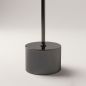 Preview: Round black base of the Double Moon floor lamp with slim rod rising upward