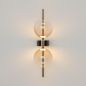 Preview: Design wall light black two glass balls glowing warm white, close-up