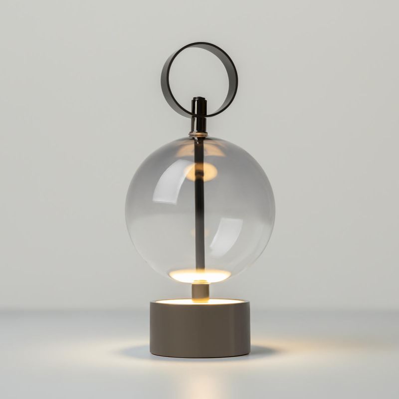 Preview: Design cordless lamp black glass ball lit from below, warm LED light glowing