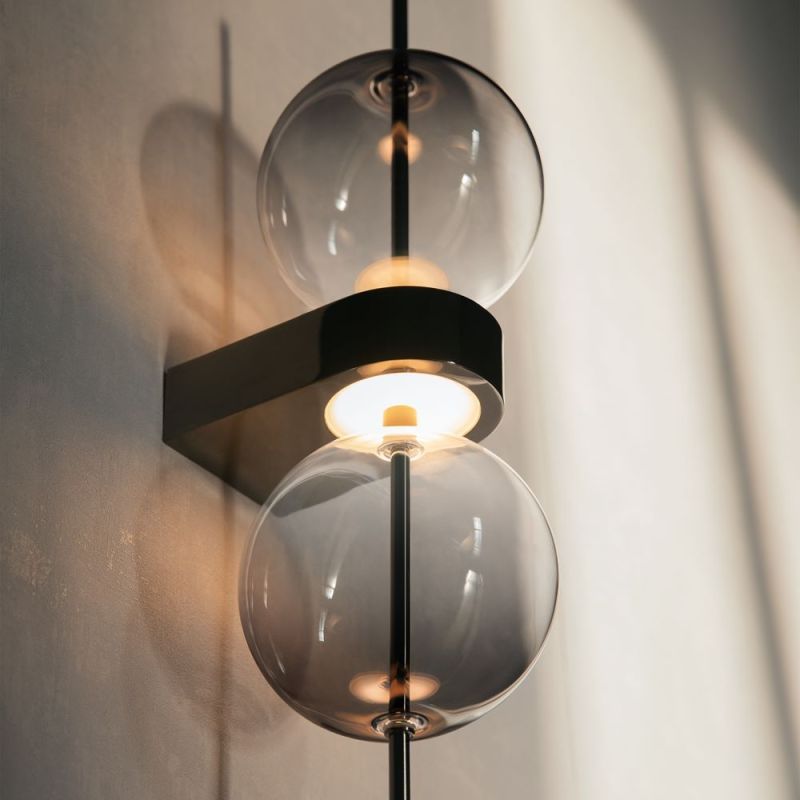 Elegant wall light with 2 grey glass spheres and soft light
