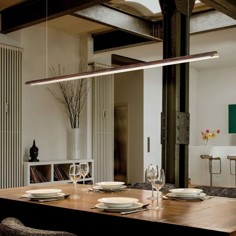 Narrow long pendant lamp Tile above the dining table in oxidized brown and ceiling canopy in brown
