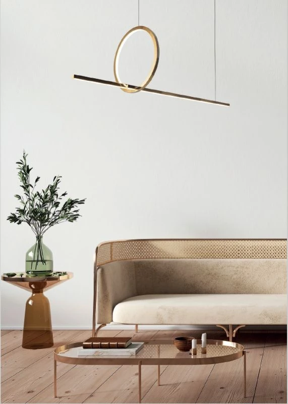 Golden pendant light above couch table