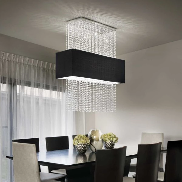 Square crystal pendant lamp with black lampshade over dining table