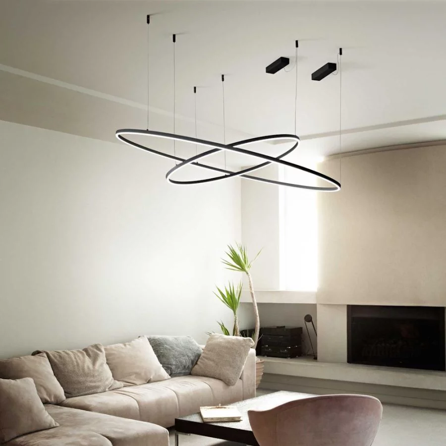 Two black ring pendant lights above the couchtable