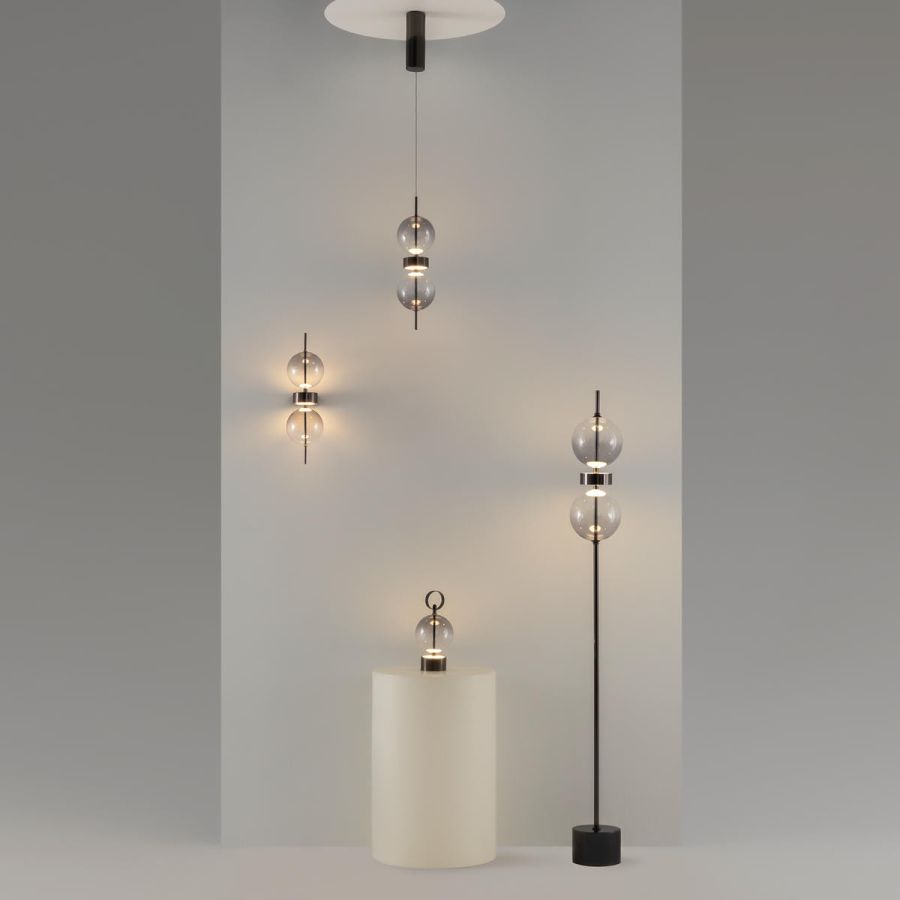 Black design wall lamp two glass balls in grey studio, series overview