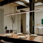 Narrow long pendant lamp Tile above the dining table