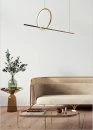 Golden pendant light above couch table